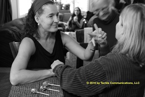 Two Women Tactiling at Table